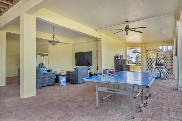 view of patio with a ceiling fan and outdoor dining area