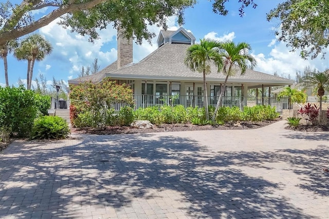 92 Tidy Island Blvd, Bradenton, FL 34210 - country-style home featuring a chimney and roof with shingles