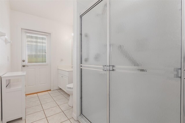 1730 Hudson St, Englewood, FL 34223 - full bath featuring vanity, a stall shower, tile patterned flooring, and toilet