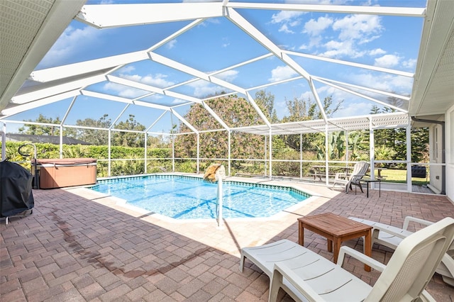 1730 Hudson St, Englewood, FL 34223 - outdoor pool with a hot tub, a patio area, glass enclosure, and a grill