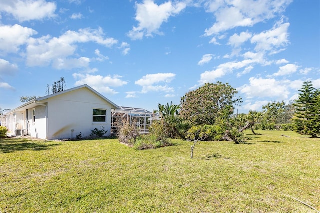 1730 Hudson St, Englewood, FL 34223 - view of grassy yard with a lanai