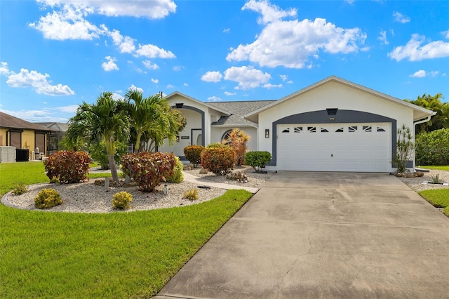 ranch-style house featuring driveway, a front yard, an attached garage, and stucco siding