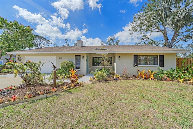 ranch-style home featuring a garage, a front yard, fence, and stucco siding