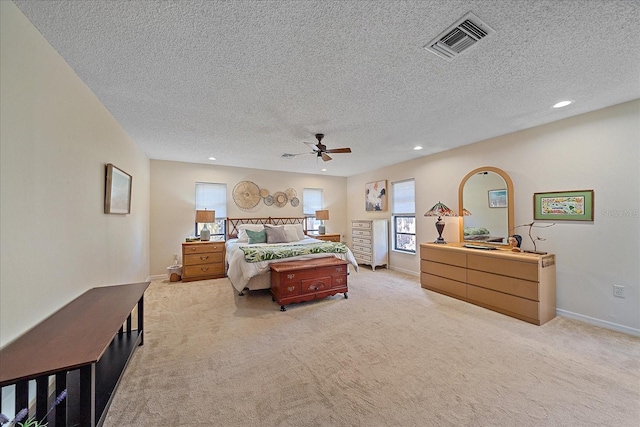 bedroom featuring light colored carpet, visible vents, baseboards, and recessed lighting