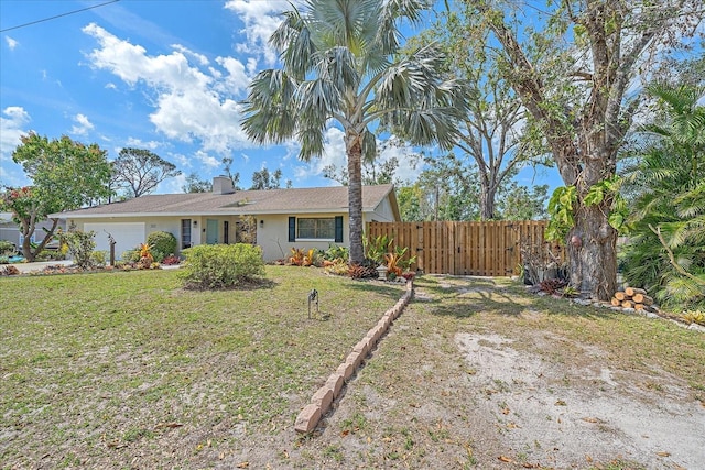 ranch-style house with a chimney, stucco siding, a front yard, fence, and a garage