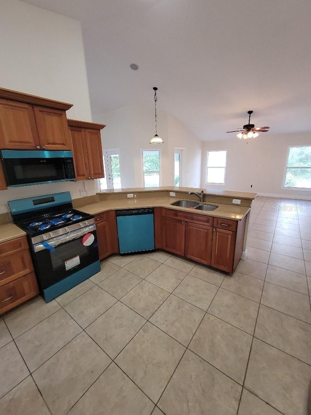 kitchen with brown cabinetry, dishwashing machine, stainless steel range with gas cooktop, black microwave, and a sink