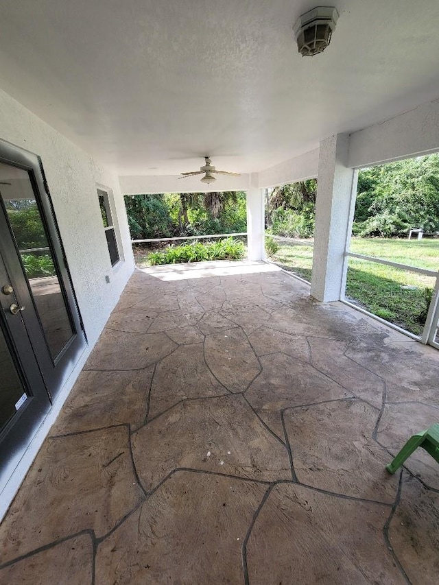 view of patio featuring ceiling fan