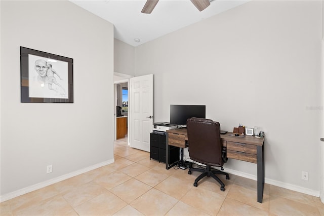 office area featuring light tile patterned flooring, a ceiling fan, and baseboards