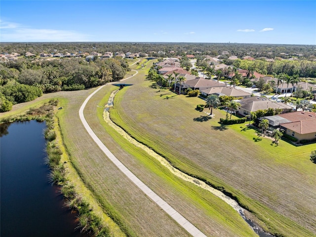 bird's eye view featuring a water view and a residential view