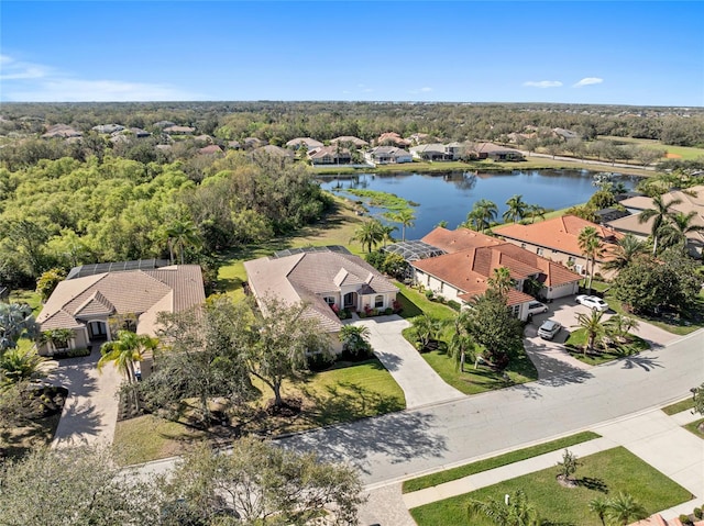 drone / aerial view featuring a residential view and a water view