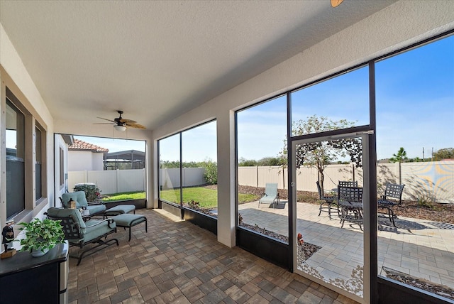 sunroom / solarium with ceiling fan