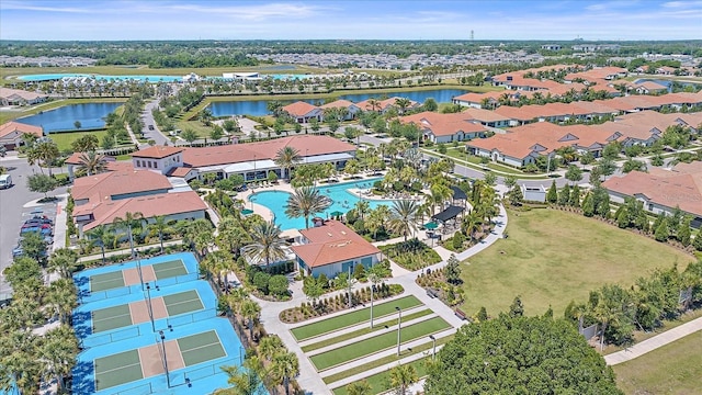 birds eye view of property with a water view and a residential view