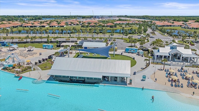 bird's eye view featuring a water view and a residential view