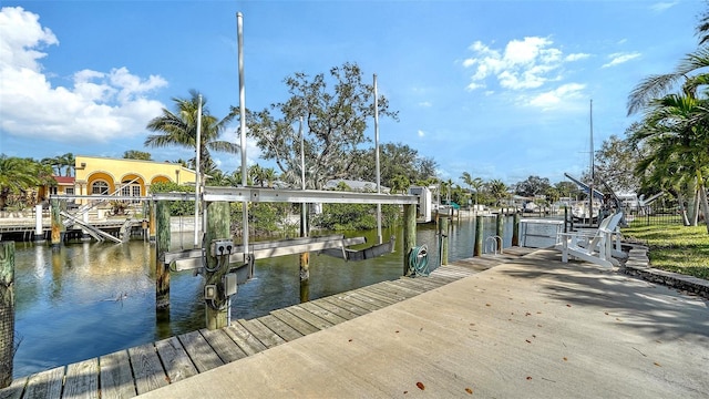 view of dock with a water view and boat lift