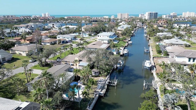bird's eye view featuring a residential view and a water view