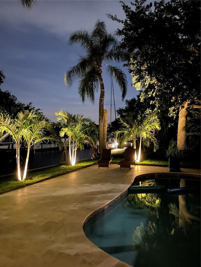 view of community featuring a patio and a pool