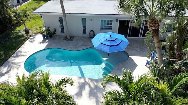 view of pool featuring a patio area and fence