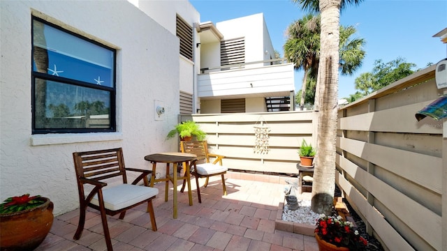 view of patio / terrace featuring fence