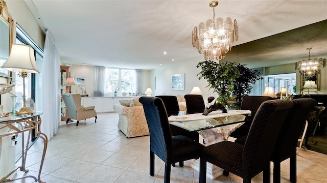 dining space featuring recessed lighting, light tile patterned floors, and an inviting chandelier