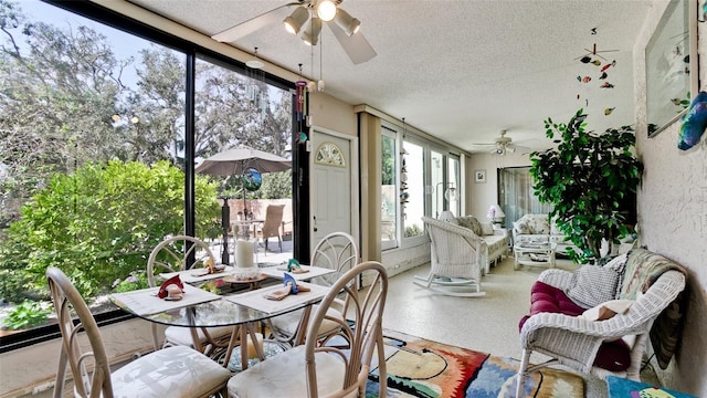 sunroom with a ceiling fan