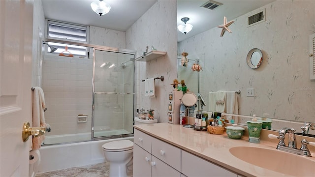 bathroom with toilet, vanity, visible vents, and wallpapered walls