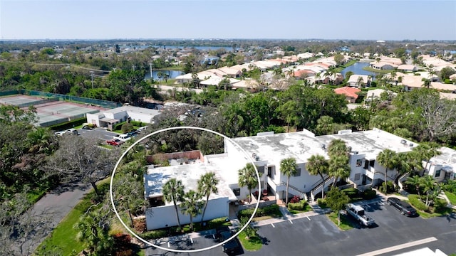 bird's eye view featuring a residential view and a water view