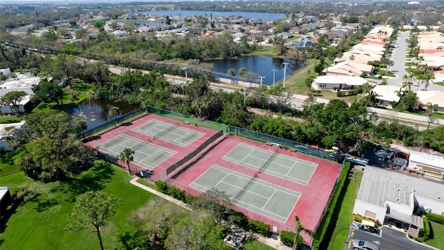 drone / aerial view with a water view and a residential view