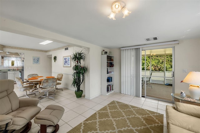 living area with light tile patterned flooring and visible vents