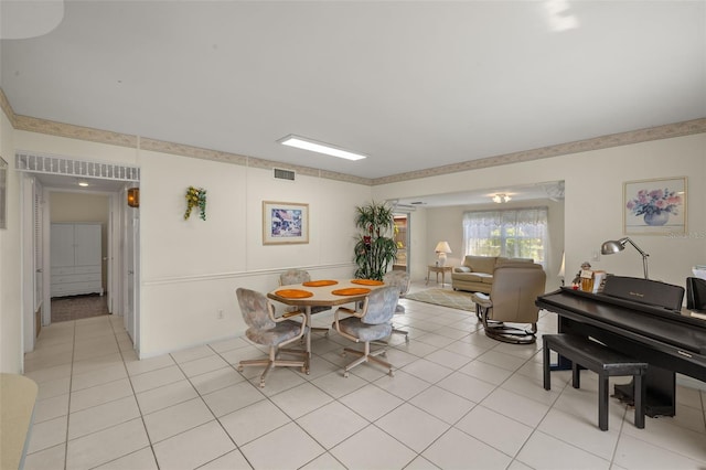 dining room with light tile patterned floors and visible vents