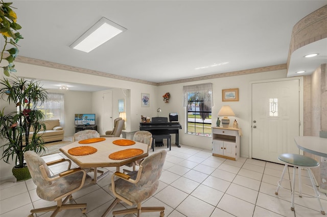 dining room featuring light tile patterned floors and a healthy amount of sunlight