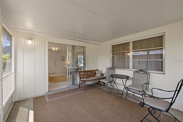 sunroom / solarium featuring a healthy amount of sunlight