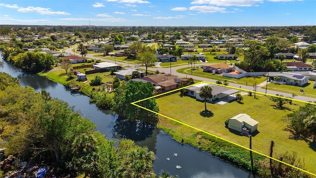 bird's eye view with a water view and a residential view