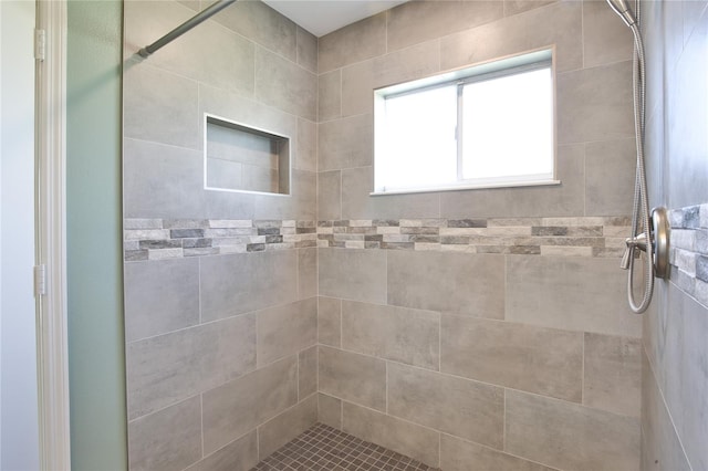 bathroom with tiled shower