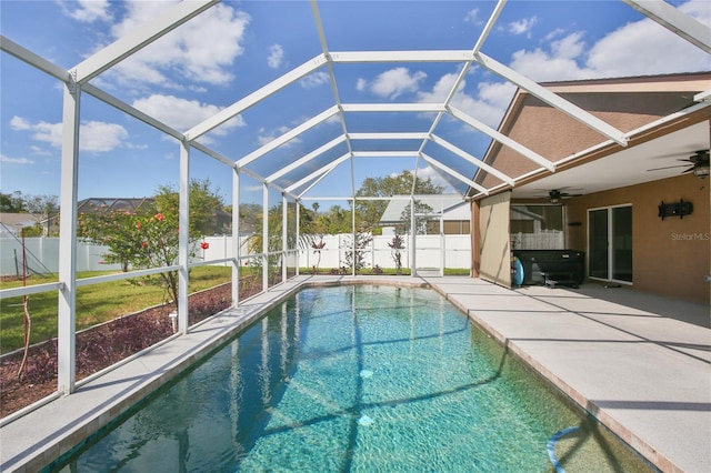 view of swimming pool featuring a patio area, a fenced backyard, ceiling fan, and a fenced in pool