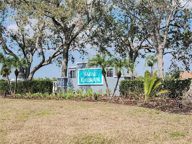 community sign featuring a lawn