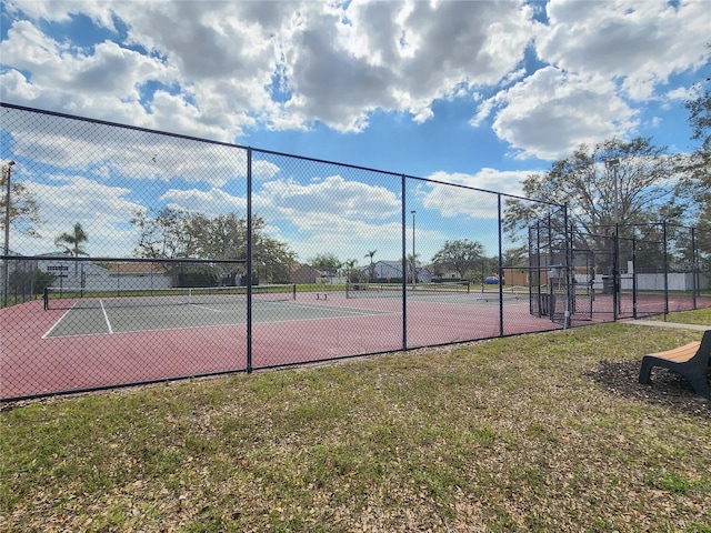 view of sport court with fence