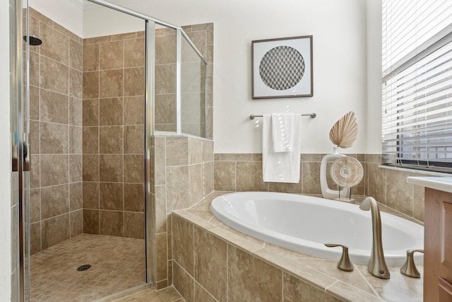 bathroom with a garden tub and a shower stall