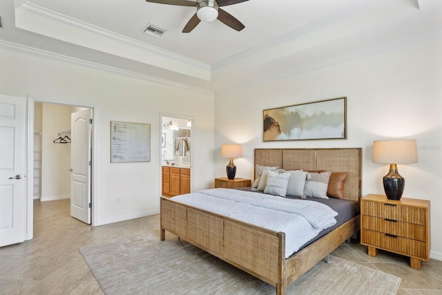 bedroom with a raised ceiling, visible vents, crown molding, and baseboards