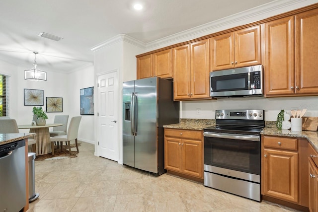 kitchen featuring pendant lighting, stone countertops, appliances with stainless steel finishes, brown cabinets, and crown molding