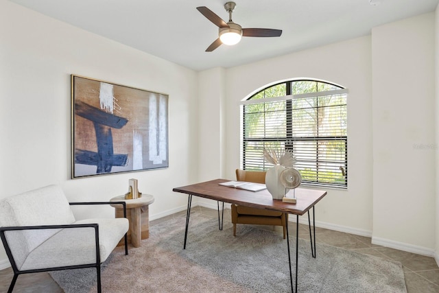 office with baseboards, a ceiling fan, and light tile patterned flooring