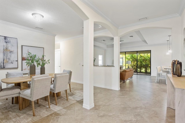 dining space with light tile patterned floors, arched walkways, visible vents, baseboards, and crown molding