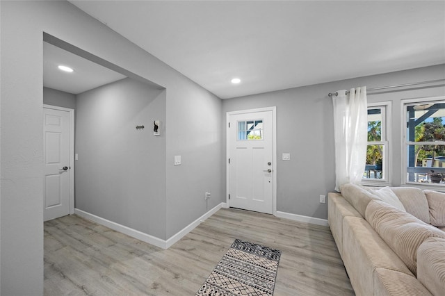 691 Gulf Bay Rd, Longboat Key, FL 34228 - entryway featuring light wood-style flooring, baseboards, and recessed lighting