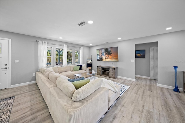 691 Gulf Bay Rd, Longboat Key, FL 34228 - living area featuring light wood-style flooring, recessed lighting, and baseboards