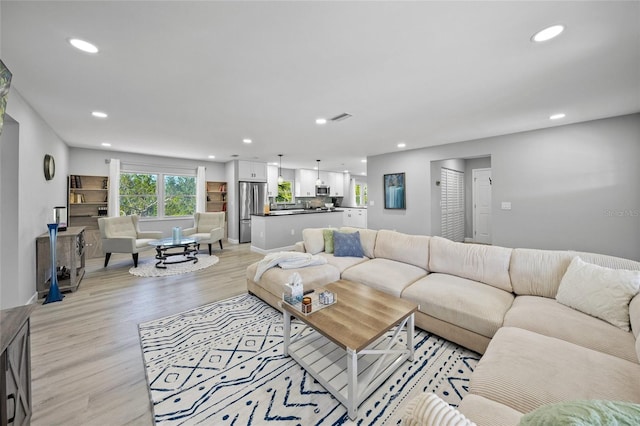 691 Gulf Bay Rd, Longboat Key, FL 34228 - living area featuring recessed lighting and light wood finished floors