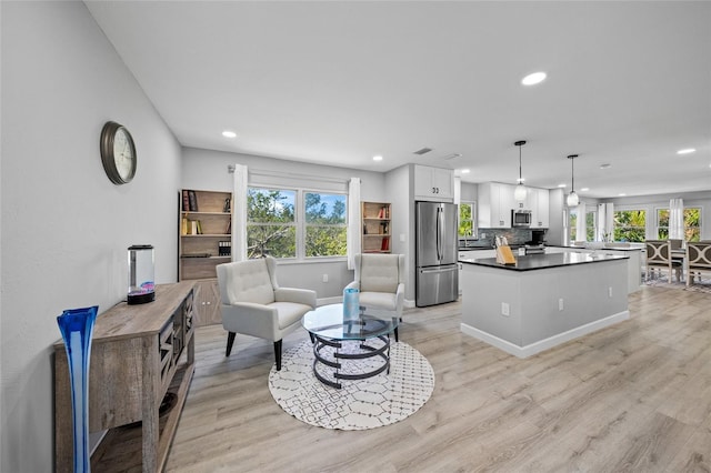 691 Gulf Bay Rd, Longboat Key, FL 34228 - living area featuring recessed lighting, light wood finished floors, and baseboards