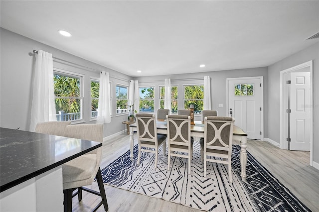 691 Gulf Bay Rd, Longboat Key, FL 34228 - dining room with light wood-type flooring, recessed lighting, and baseboards