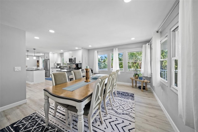 691 Gulf Bay Rd, Longboat Key, FL 34228 - dining space featuring recessed lighting, light wood-style floors, and baseboards