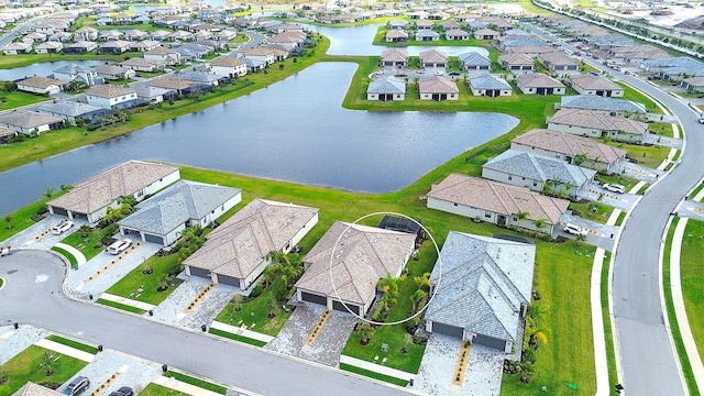 aerial view with a residential view and a water view