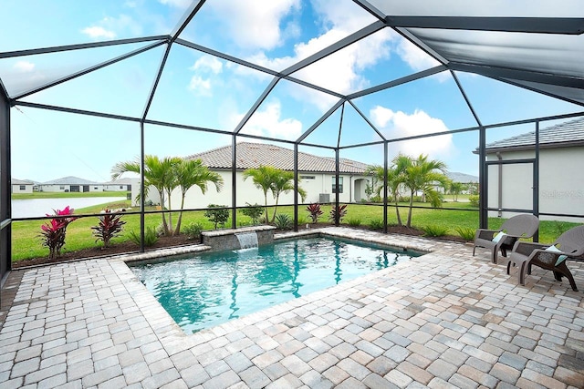 outdoor pool featuring a yard, a patio area, and a lanai