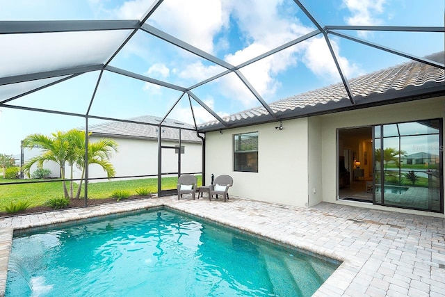 outdoor pool with a patio and a lanai